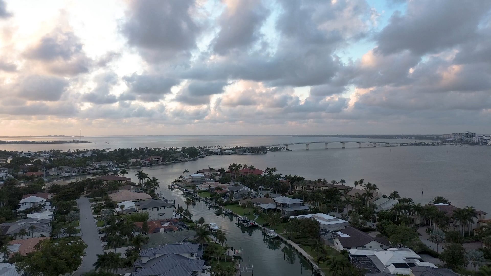 Aerial view of waterfront homes in Cape Coral, Florida at sunset